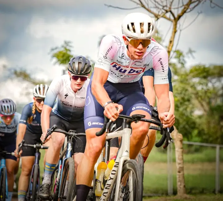 Riders in a tight bunch on drop-bar bikes